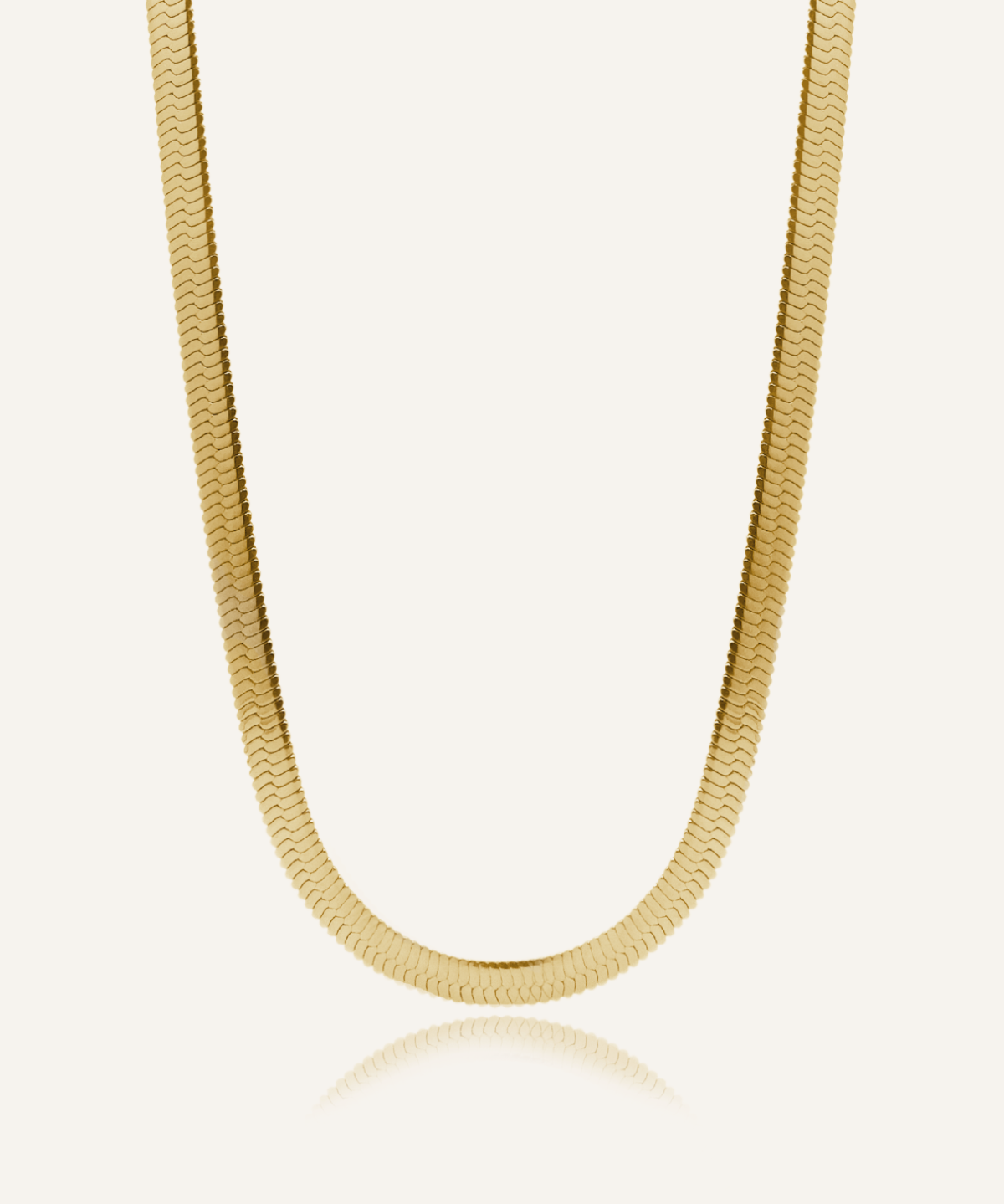 Flatlay of Capri Necklace showing its bold gold herringbone chain design.
