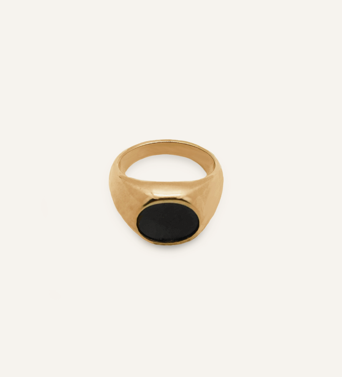 Flatlay of Caro Ring showing dome shape with black enamel center.