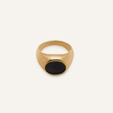 Flatlay of Caro Ring showing dome shape with black enamel center.