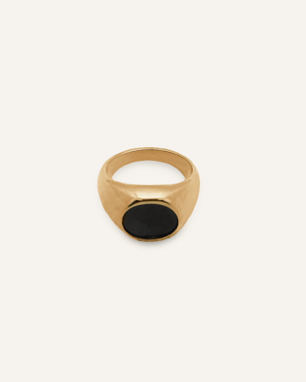 Flatlay of Caro Ring showing dome shape with black enamel center.