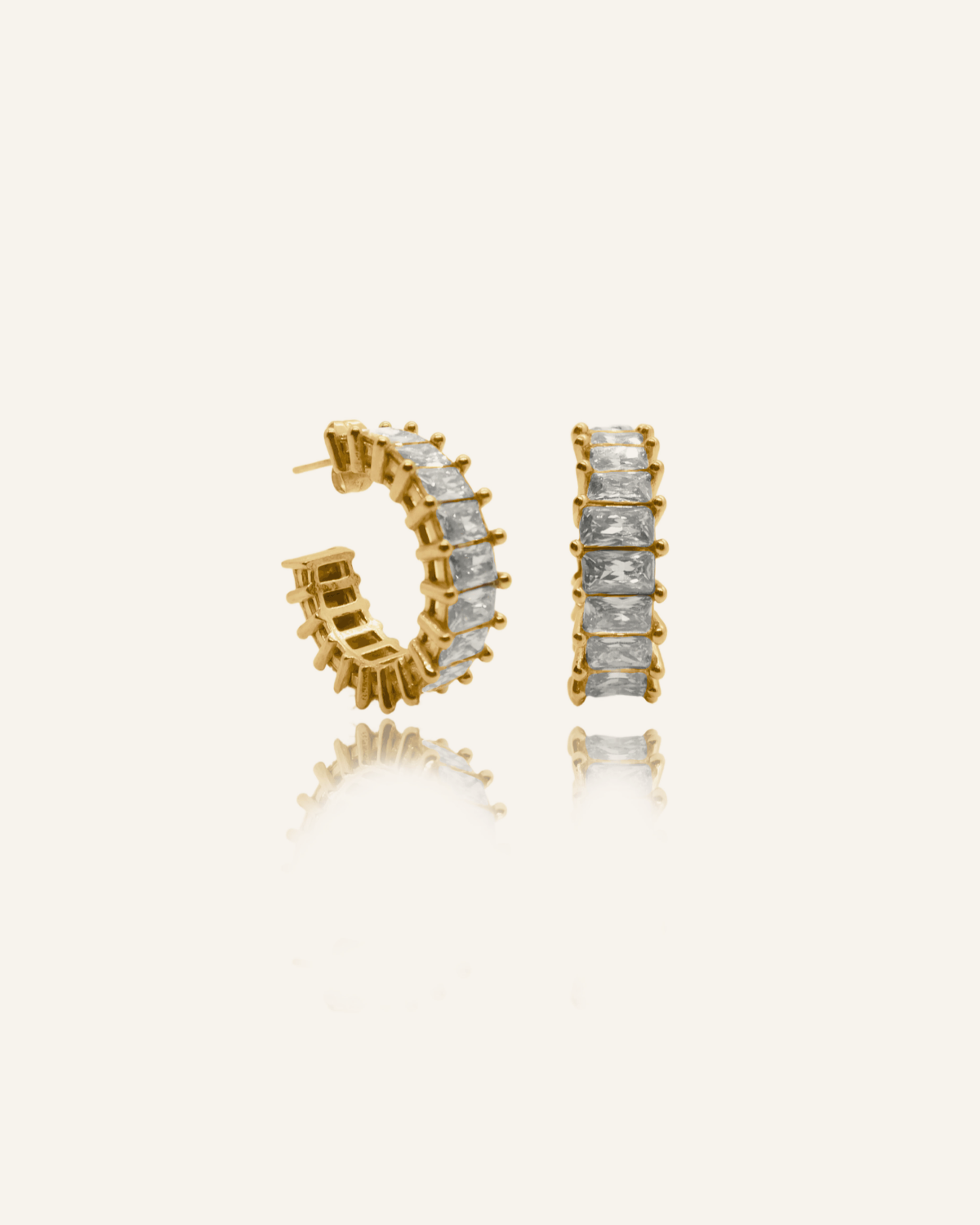Ciana Earrings featuring rectangular zirconia stones on gold.