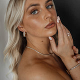 Ciana Earrings styled in everyday outfit, front view angle.