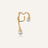 Dahlia Ear Cuff product flatlay with gold branches and faux pearl tips.