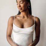 Half-body view of model wearing Dahlia Ear Cuff styled with a minimal outfit.