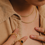 Damian gold rope chain necklace styled in a closeup view—refined and versatile.
