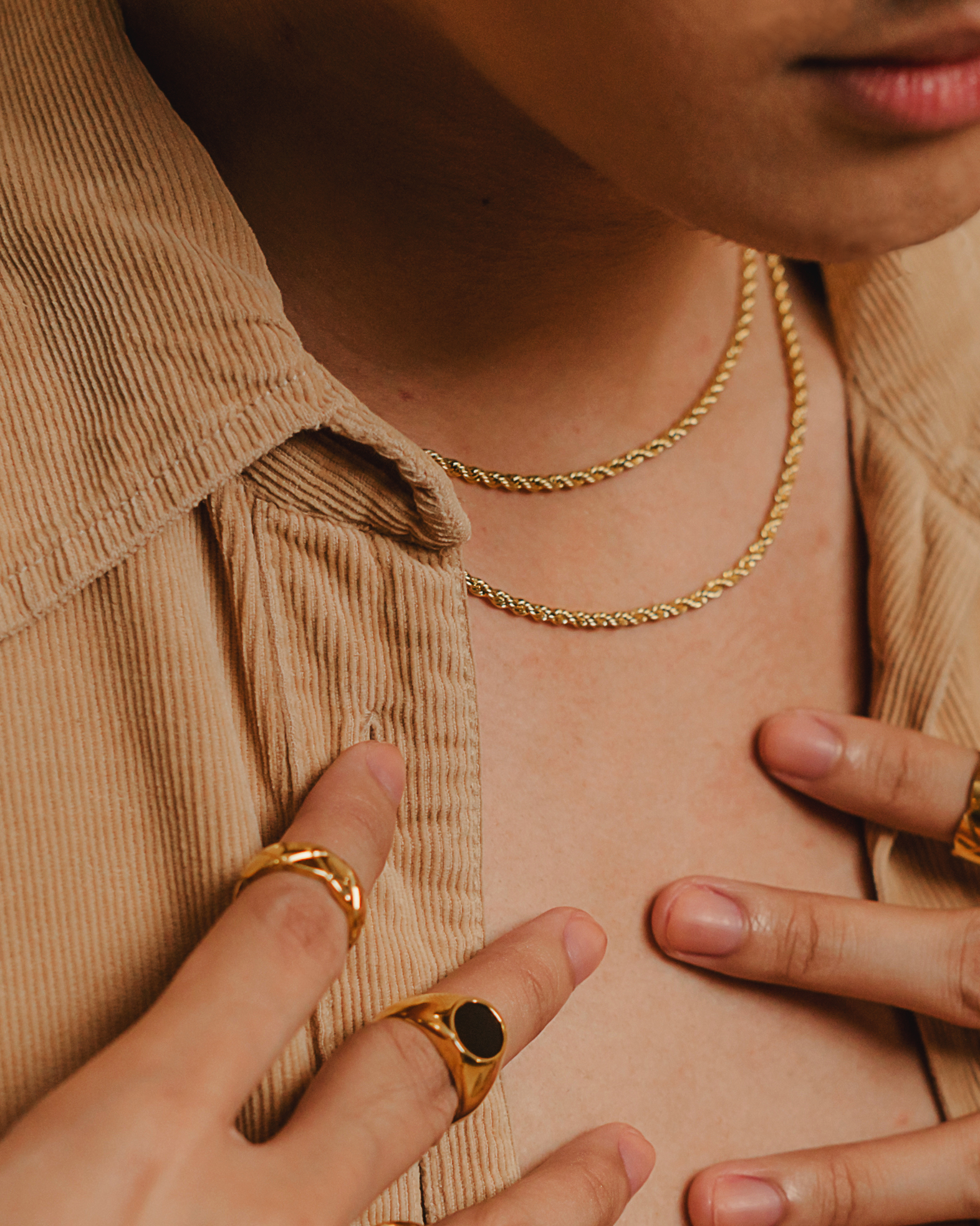 Damian gold rope chain necklace styled in a closeup view—refined and versatile.