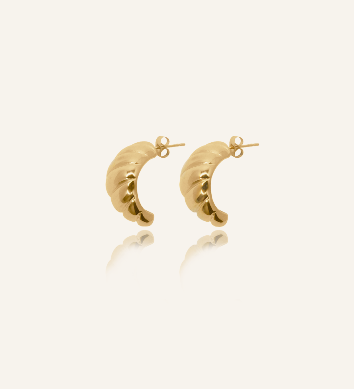 Demi Earrings product image showcasing twisted gold hoop design.