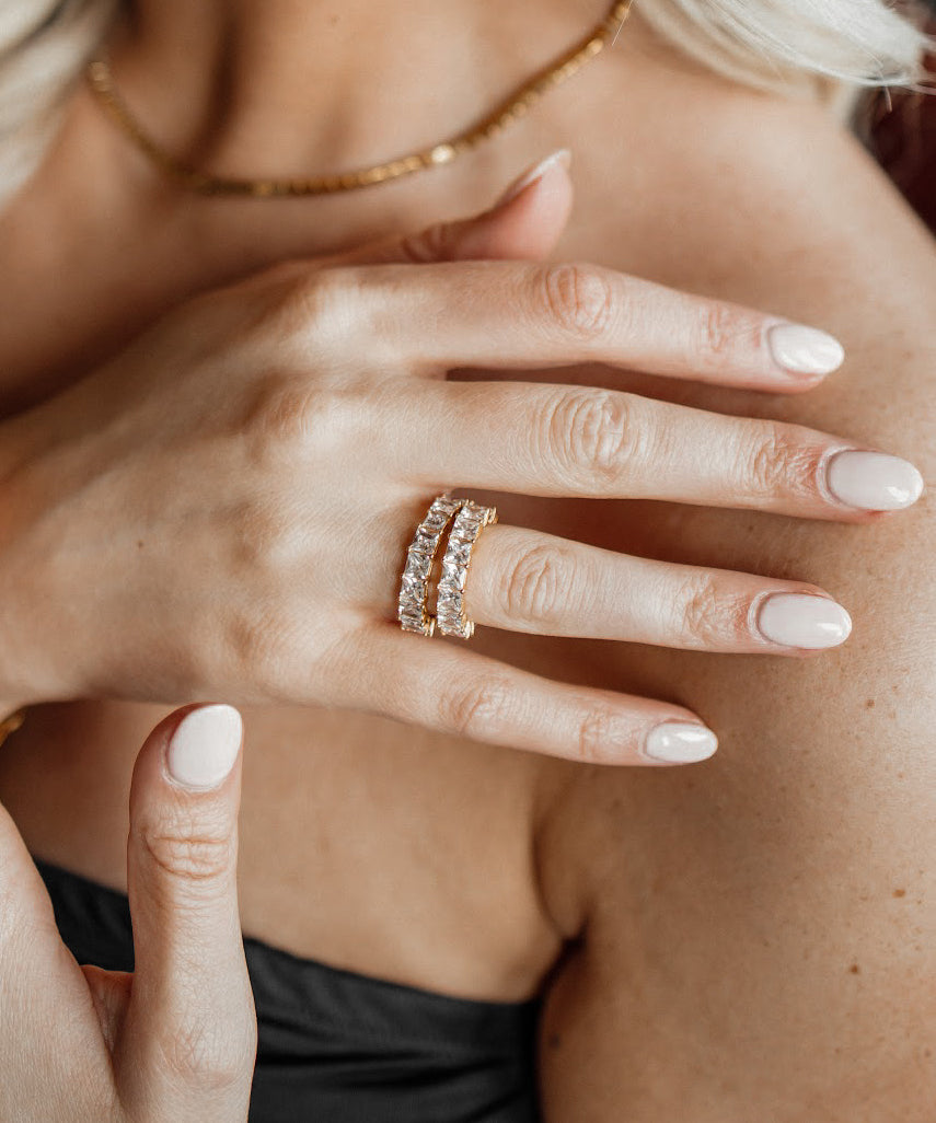 Closeup view of Elia Ring worn on hand, highlighting detailed pave zirconia setting.