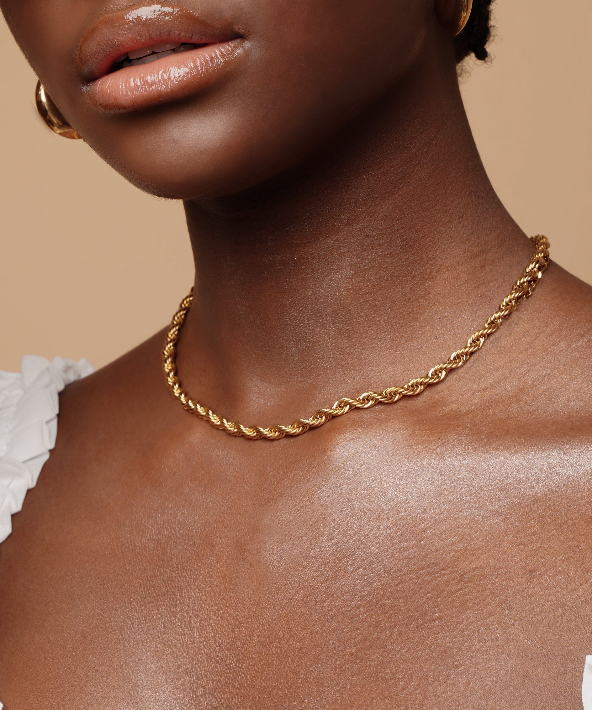 Closeup of Fiona Necklace worn, highlighting the thick rope design and gold finish.