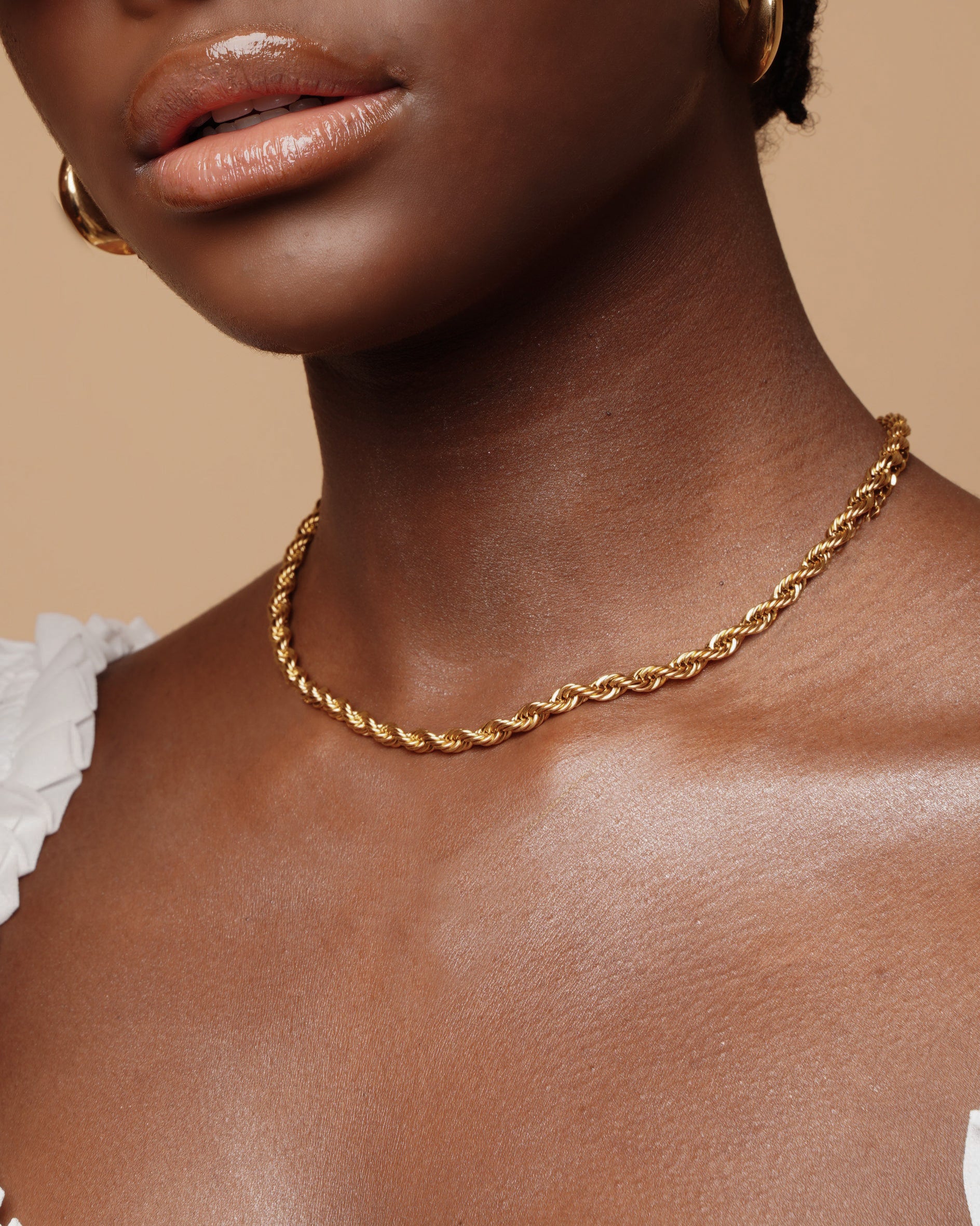 Closeup of Fiona Necklace worn, highlighting the thick rope design and gold finish.