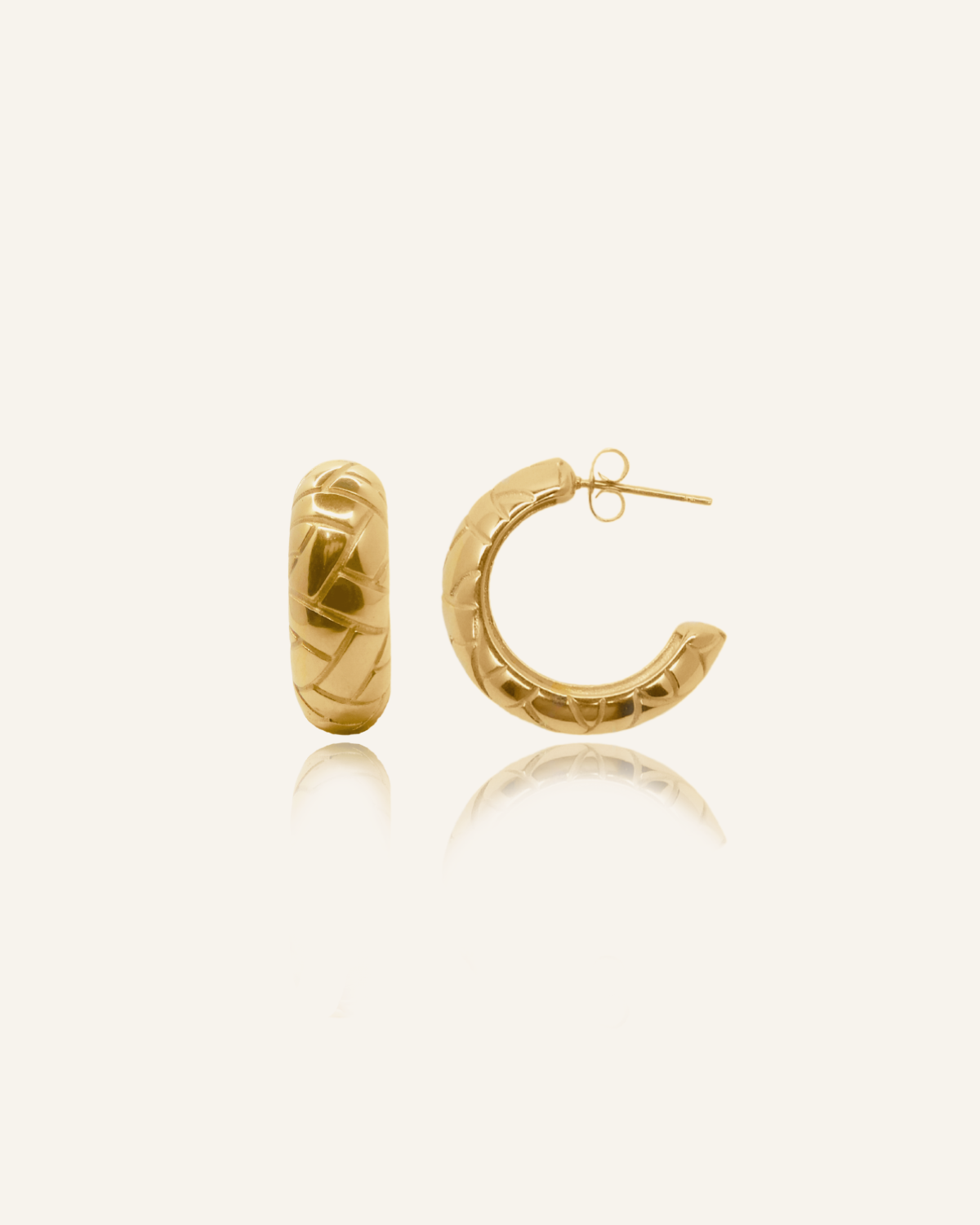 Product flatlay of Gaia Earrings showcasing semi-hoop design with woven texture.