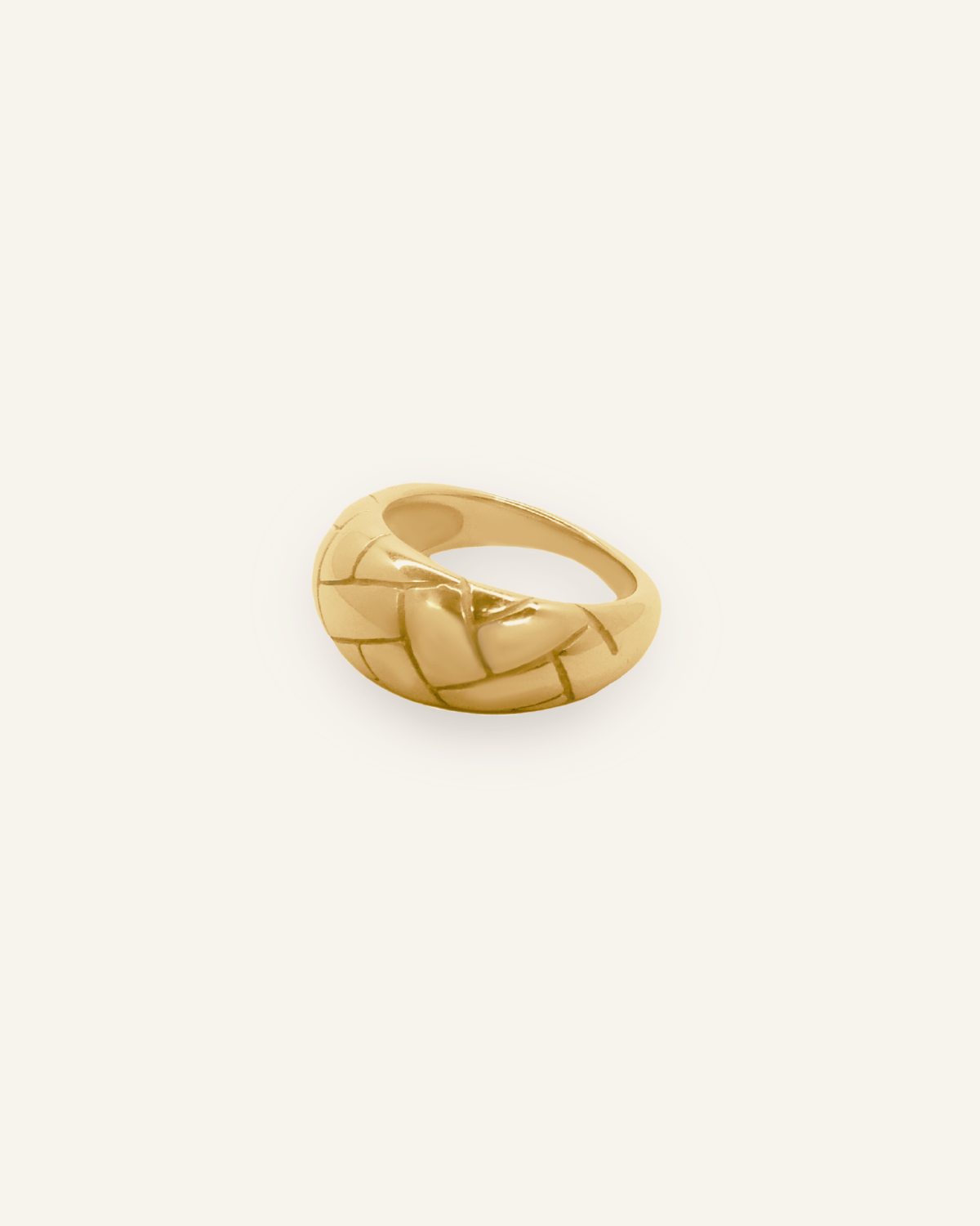 Flatlay image of Gaia Ring showcasing woven dome design in 18k gold.