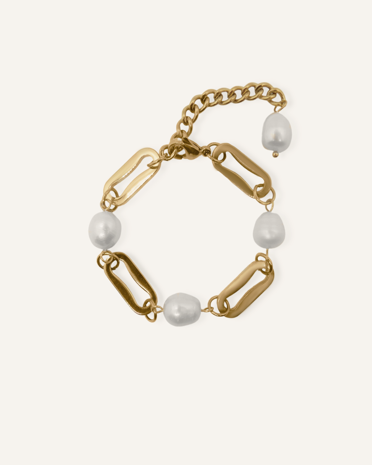 Harriet Bracelet featuring baroque freshwater pearls and gold rectangular chains on a flatlay display.