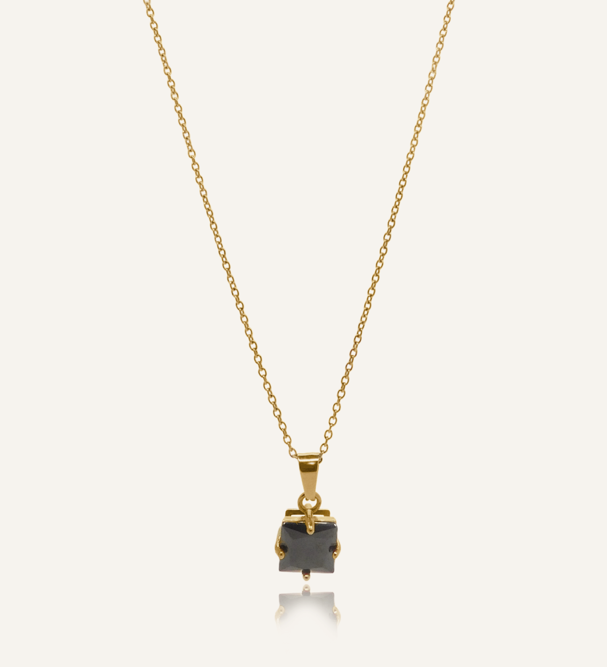Kamaria Necklace with a bold black onyx pendant on an 18k gold-coated cable chain.