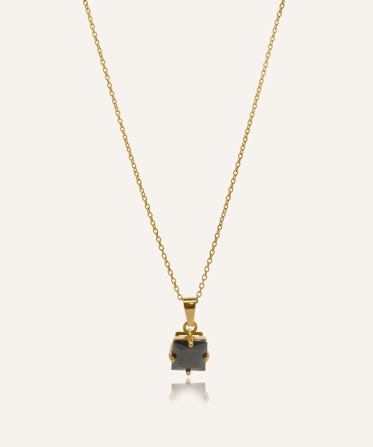Kamaria Necklace with a bold black onyx pendant on an 18k gold-coated cable chain.