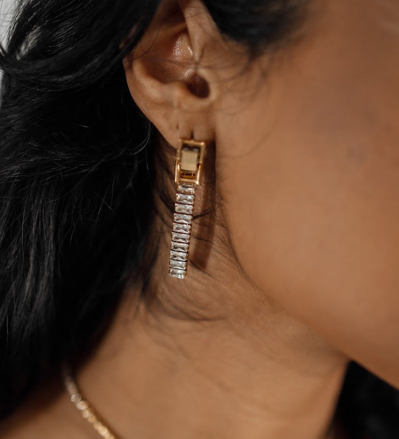 Closeup of Laena Earrings worn, showcasing dazzling zircon dangle.