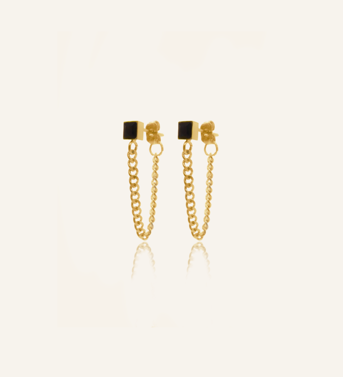 Flatlay of Laurie Earrings showing black cube onyx and curb chain design.