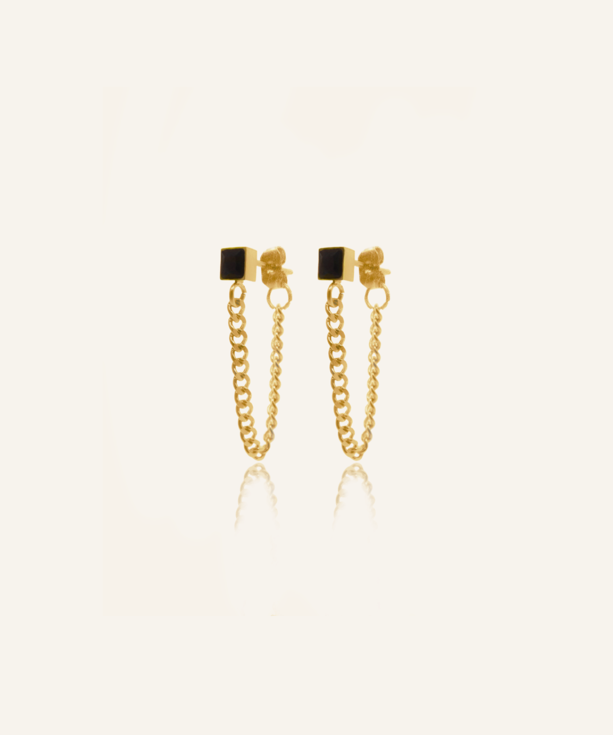 Flatlay of Laurie Earrings showing black cube onyx and curb chain design.