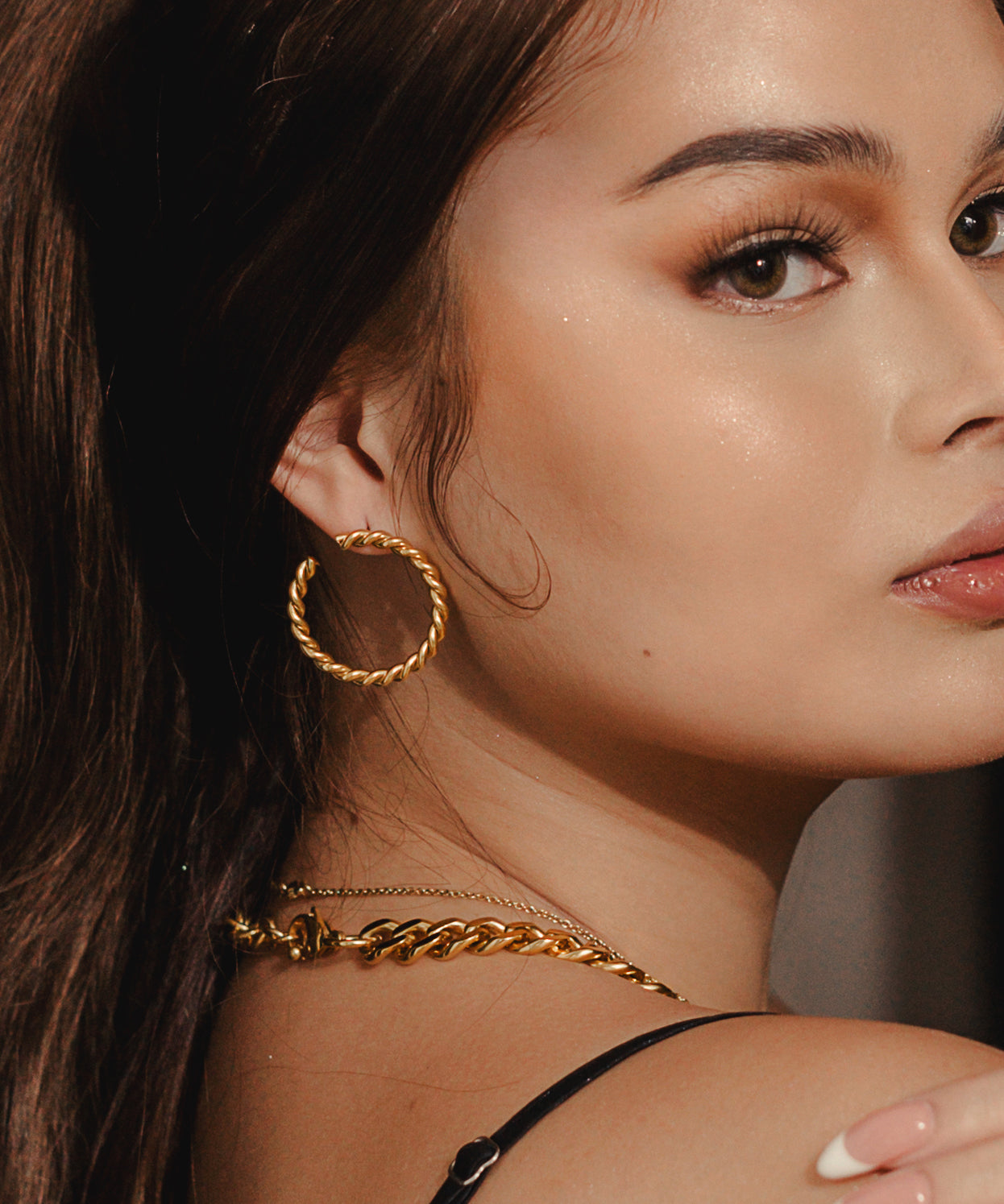 Closeup view of Selene Earrings worn, highlighting the twisted texture.