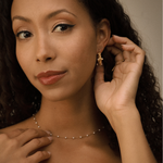 Front view of Tyla Earrings, highlighting symmetrical pearl and zirconia accents.