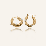 Tyla Earrings featuring freshwater pearls and white zirconia on gold hoops.