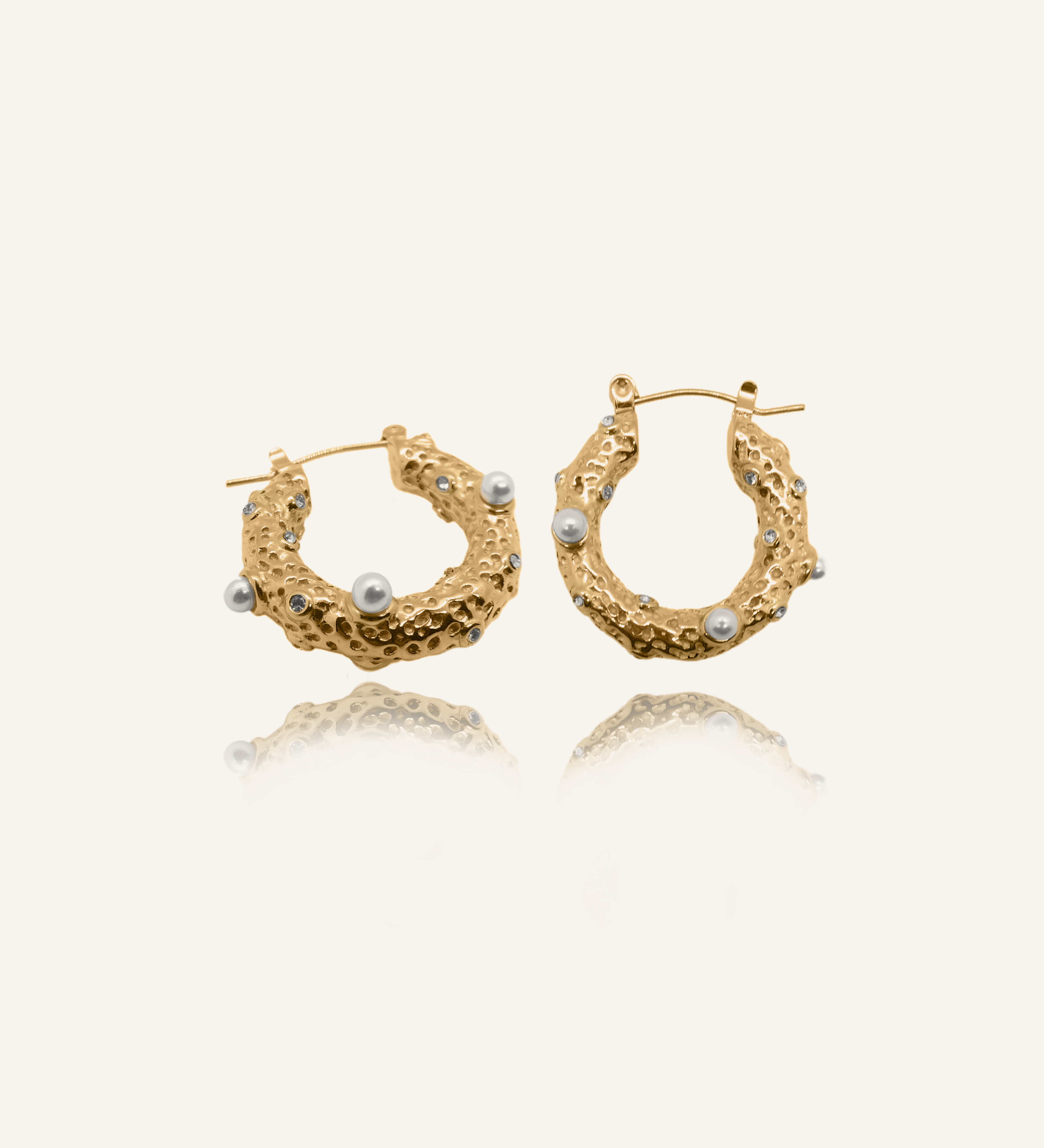Tyla Earrings featuring freshwater pearls and white zirconia on gold hoops.
