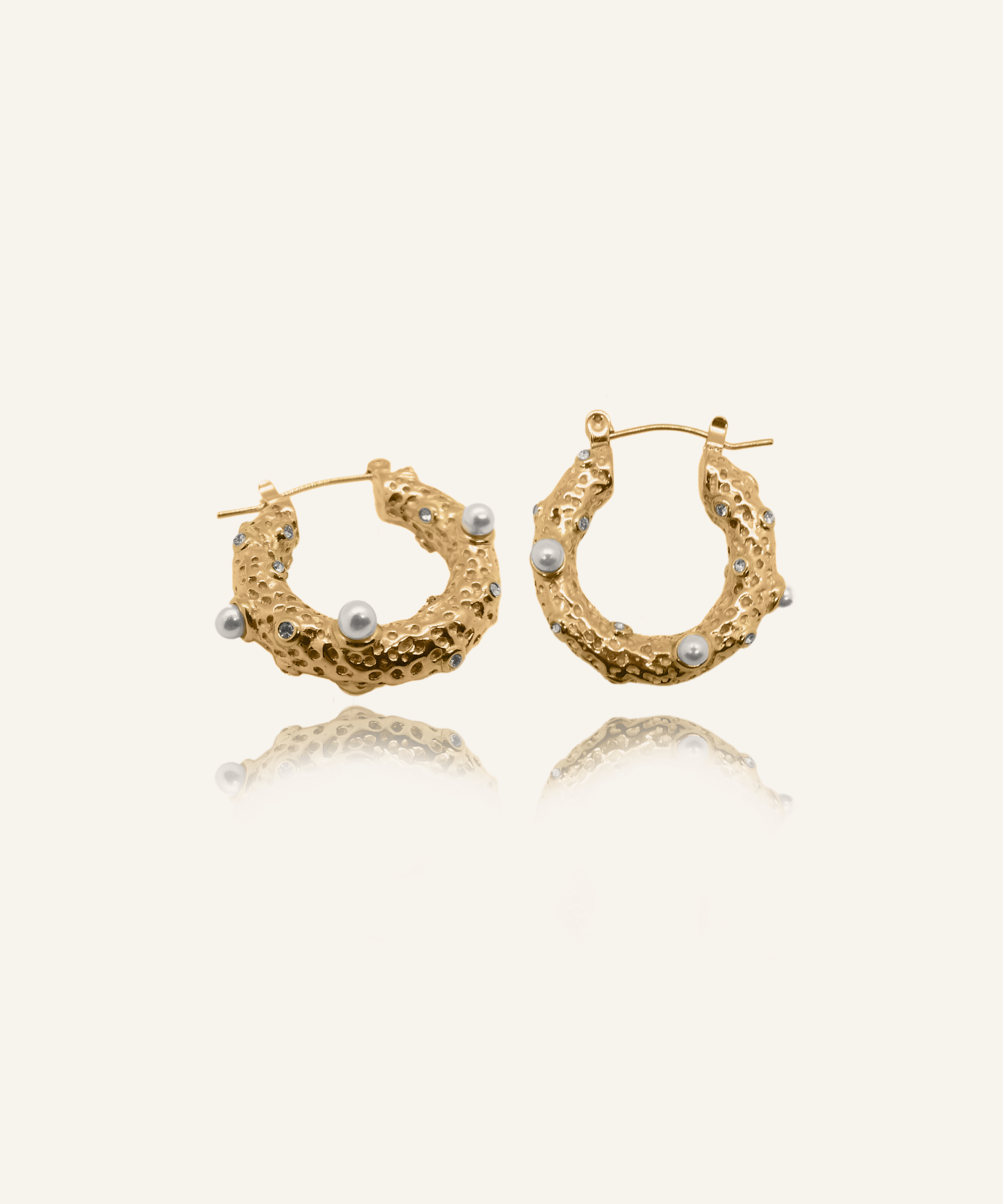 Tyla Earrings featuring freshwater pearls and white zirconia on gold hoops.
