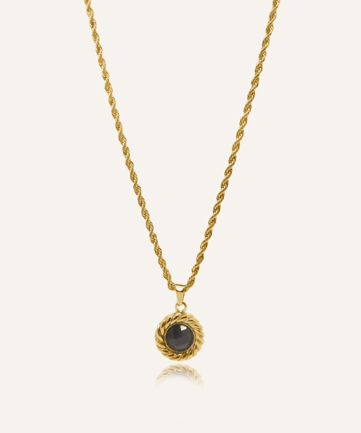Valeriana Necklace product flatlay featuring gold rope chain and onyx pendant.