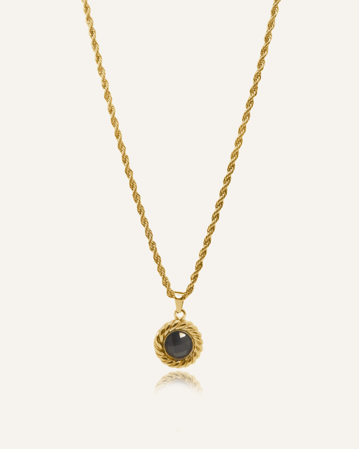 Valeriana Necklace product flatlay featuring gold rope chain and onyx pendant.