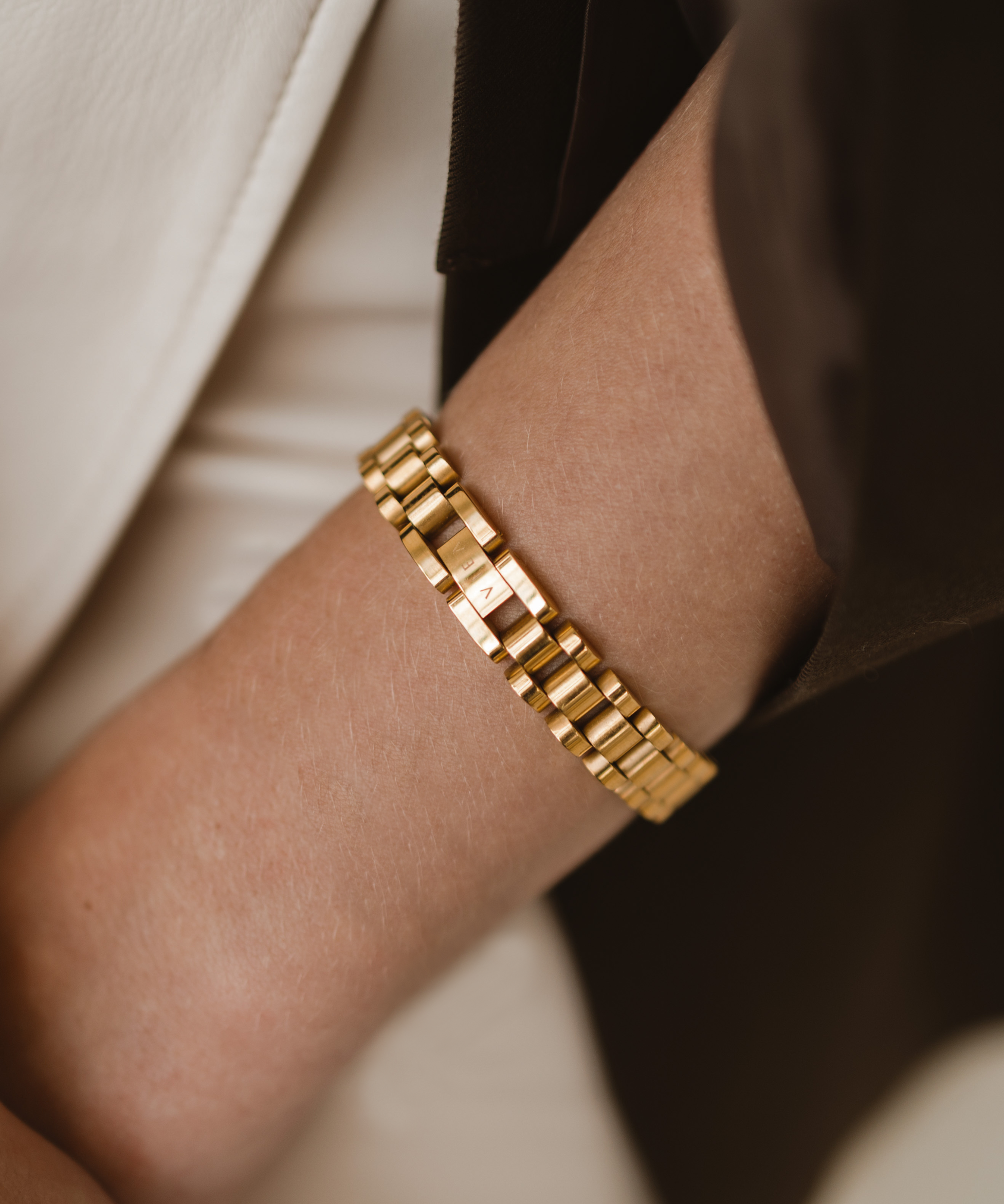 Close-up of the Zain Watchband worn on wrist, showcasing 18k gold finish.