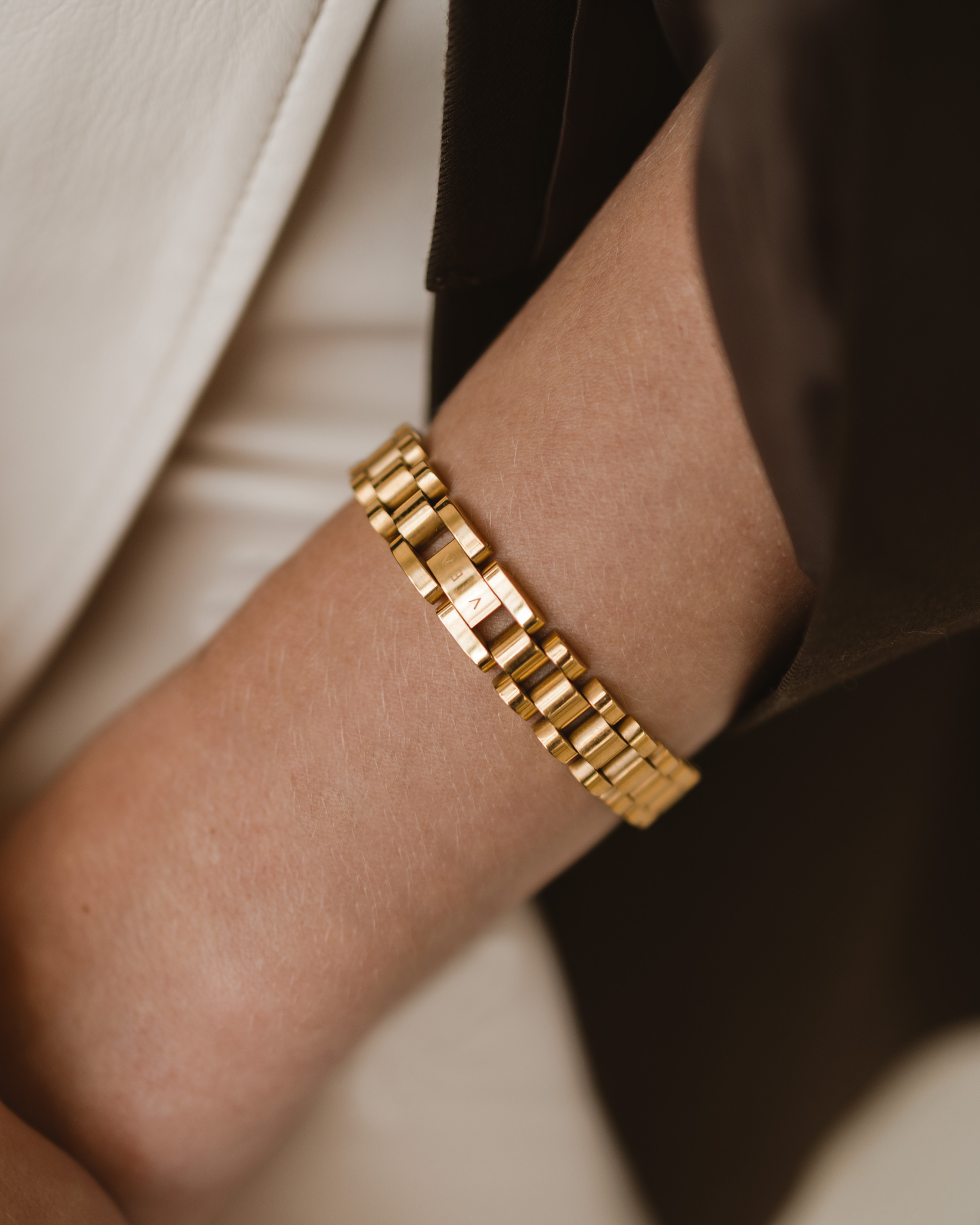 Close-up of the Zain Watchband worn on wrist, showcasing 18k gold finish.